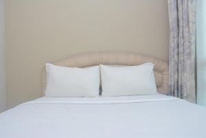 Warm and Cozy 2BR Apartment Woodland Park Residence By Travelio