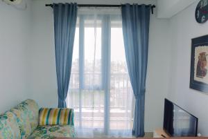 Spacious 2BR at Royal Olive Apartment By Travelio