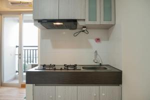 Homey Studio at Sentraland Cengkareng Apartment near Airport By Travelio