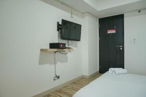 Homey Studio at Sentraland Cengkareng Apartment near Airport By Travelio