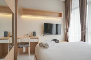 Fully Furnished with New Design Studio Ciputra International Apartment By Travelio
