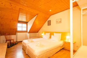 Appartements Schriner Huss - Chambres d'hotes & Gites : photos des chambres