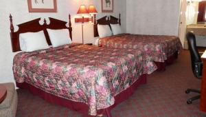 Queen Room with Two Queen Beds - Non-Smoking room in Magnuson Hotel Fowlerville