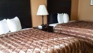 Queen Room with Two Queen Beds - Non-Smoking room in Magnuson Hotel Brownsville