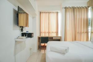 Chic and Cozy Studio at Tifolia Apartment By Travelio