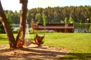 Domki Mazurskie w Ogrodach Złotej Łani Wiartel - Klimatyczne Apartamenty i Pokoje Widokowe