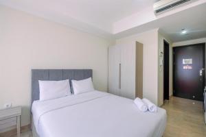 Warm and Cozy Studio Room at Menteng Park Apartment By Travelio