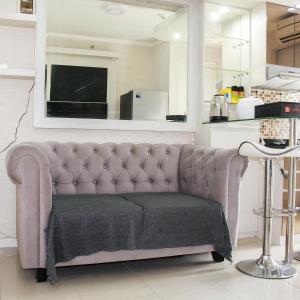 Comfort 2BR Bassura City Apartment near Shopping Center By Travelio