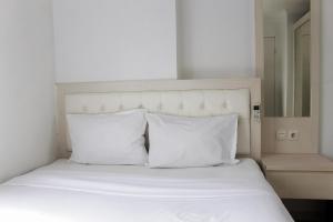 Comfort 2BR Bassura City Apartment near Shopping Center By Travelio