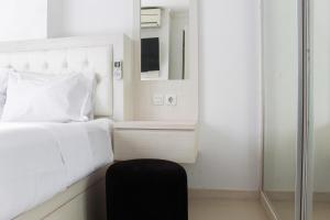 Comfort 2BR Bassura City Apartment near Shopping Center By Travelio