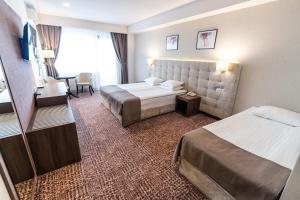 Triple Room with Balcony Grand Belvedere room in Grand Hotel Belvedere