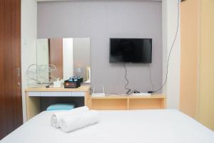 Cozy Stay 1BR at Grand Kamala Lagoon Apartment By Travelio