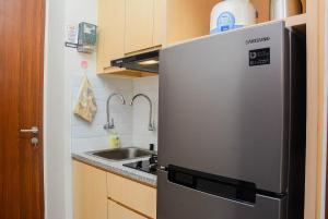 Cozy Stay 1BR at Grand Kamala Lagoon Apartment By Travelio