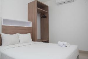 Modern 1BR at Ciputra World 2 Apartment By Travelio