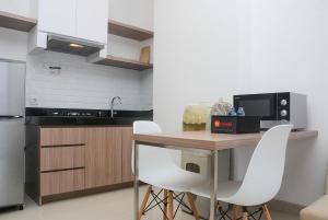Modern 1BR at Ciputra World 2 Apartment By Travelio