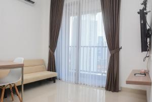 Modern 1BR at Ciputra World 2 Apartment By Travelio