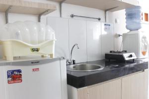 Bright Studio Room at Dago Suites Apartment near ITB By Travelio