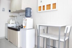 Bright Studio Room at Dago Suites Apartment near ITB By Travelio