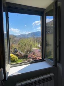 Maisons d'hotes Au Pont d’Olt : Chambre Triple - Vue sur Jardin