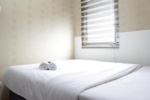 Strategic & Relaxing 2BR at Gateway Apartment Ahmad Yani Cicadas By Travelio