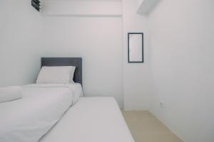 Simply Cozy 2BR Bassura City Apartment By Travelio