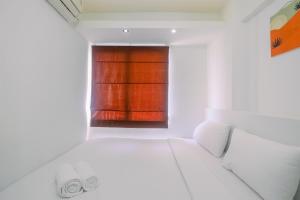 Simply Cozy 2BR Bassura City Apartment By Travelio