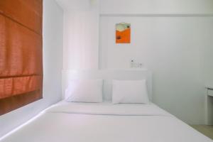 Simply Cozy 2BR Bassura City Apartment By Travelio