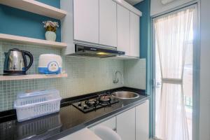 Simply Cozy 2BR Bassura City Apartment By Travelio