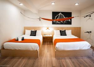 Queen Room with Two Queen Beds room in LOGE Leavenworth Downtown