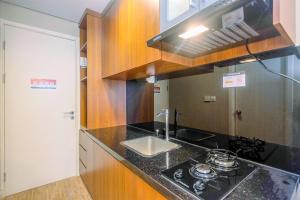 Modern and Compact Studio at Patraland Urbano Apartment By Travelio