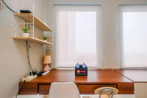 Modern and Compact Studio at Patraland Urbano Apartment By Travelio