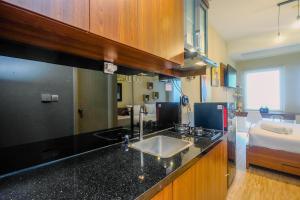 Modern and Compact Studio at Patraland Urbano Apartment By Travelio