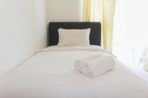 Simply Minimalist Studio at Casa De Parco Apartment By Travelio