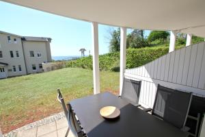 Terrasse, gratis Nutzung vom AHOI Erlebnisbad und Sauna in Sellin - Meeresblick FeWo 19