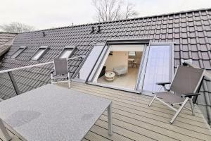 Ferienwohnung mit Dachterrasse und Meerblick - Haus Inselwind FeWo MEERwasser