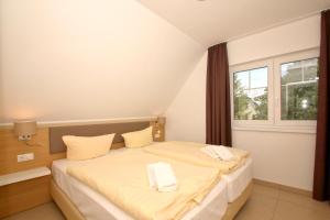 strandnahe FeWo mit Balkon, gratis Nutzung vom AHOI Erlebnisbad und Sauna in Sellin - Rex Rugia FeWo 14-8