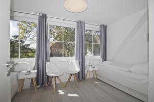 Ferienwohnung mit Meerblick, Balkon und Garten - Haus Inselblick FeWo MEERluft