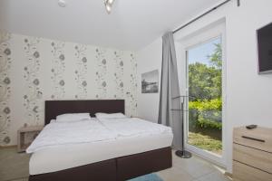 Ferienwohnung mit Kamin und Terrasse, gratis Nutzung vom AHOI Erlebnisbad und Sauna in Sellin - Villa Sara FeWo03