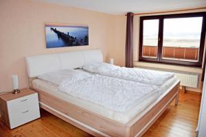 Ferienhaus mit Reetdach und Seebli
