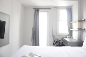 Simply 2BR without Living Room Apartment at Parahyangan Residence By Travelio