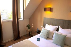 Hotels Logis Hotel Marguerite d'Anjou : photos des chambres