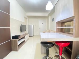 Private & Bright 2BR Apartment at Parahyangan Residence near Nara Park By Travelio