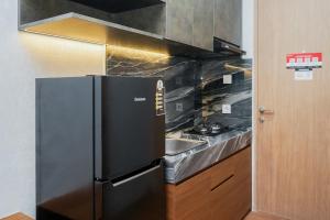 Studio Modern Japanese Style near Aeon BSD at B Residence Apartment By Travelio