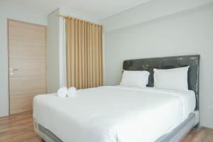Gorgeous 2BR Apartment Maqna Residence By Travelio