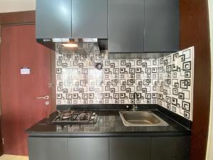 Comfy & Well Appointed 2BR at Tamansari Panoramic Apartment By Travelio