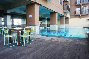 Comfy & Well Appointed 2BR at Tamansari Panoramic Apartment By Travelio