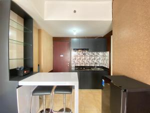 Comfy & Well Appointed 2BR at Tamansari Panoramic Apartment By Travelio