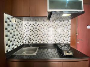 Spacious 1BR at Tamansari Panoramic Apartment near Metro Indah Mall By Travelio