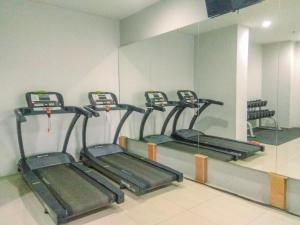 Cozy Stay 2BR Tamansari Mahogany Apartment By Travelio