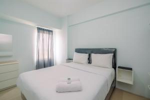 Cozy Stay 2BR Tamansari Mahogany Apartment By Travelio